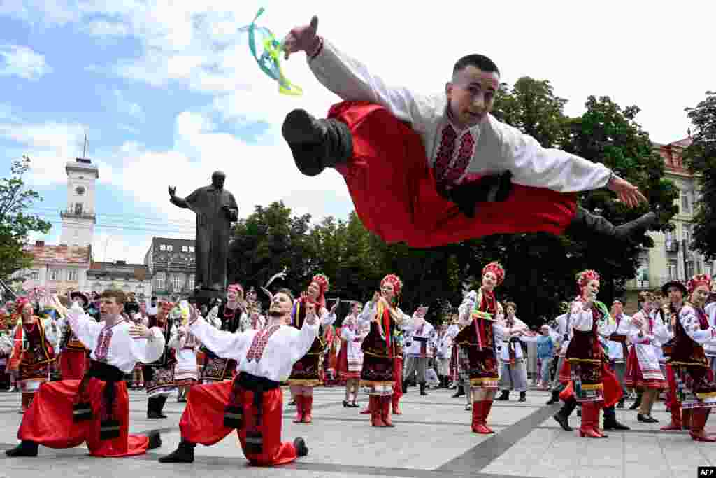 People dance traditional Ukrainian dances during the choreographic performance &quot;Dance of my people&quot; during the celebration of the Ukrainian Constitution Day in Lviv.
