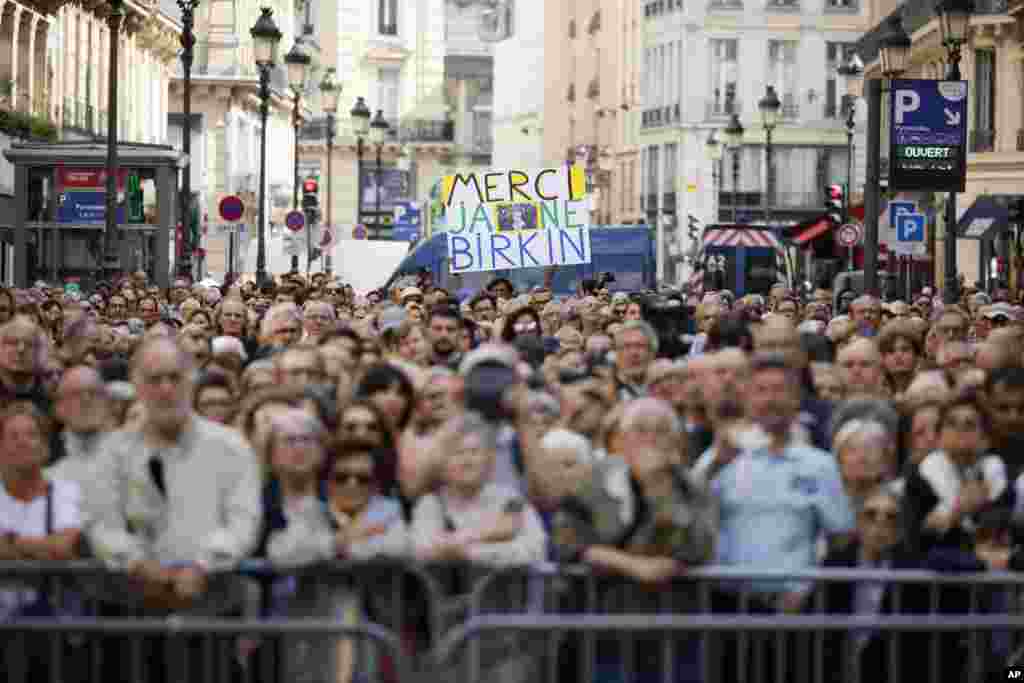 A crowd waits outside the Saint-Roch church during Jane Birkin&#39;s funerals ceremony in Paris, France.&nbsp;Actor and singer Jane Birkin, who made France her home and charmed the country with her English grace, natural style and social activism, has died last week at age 76.&nbsp;