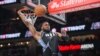 Bruno Fernando (24) des Atlanta Hawks fait un dunk contre les Boston Celtics, USA, le 25 mars 2024..
