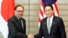 Japanese Prime Minister Fumio Kishida shakes hands with Malaysian Prime Minister Anwar Ibrahim in Tokyo, Japan, Dec. 16, 2023. 