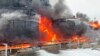 In this photo taken from video released by Governor of Bryansk Region Alexander Bogomaz telegram channel AV BogomaZ on Friday, Jan. 19, 2024, Oil reservoirs are seen in fire after the drone reached Klintsy.