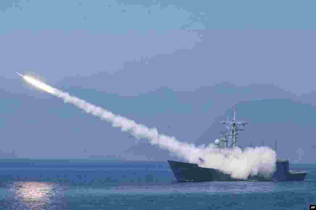 A Cheng Kung class frigate fires an anti-air missile as part of a navy demonstration in Taiwan&#39;s annual Han Kuang exercises off the island&#39;s eastern coast near the city of Yilan.