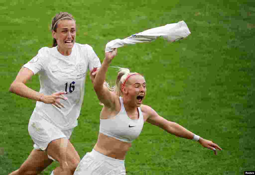 England's Chloe Kelly celebrates scoring their second goal during the final of the Women's Euro 2022 soccer match between England and Germany being played at Wembley stadium in London, July 31, 2022. 