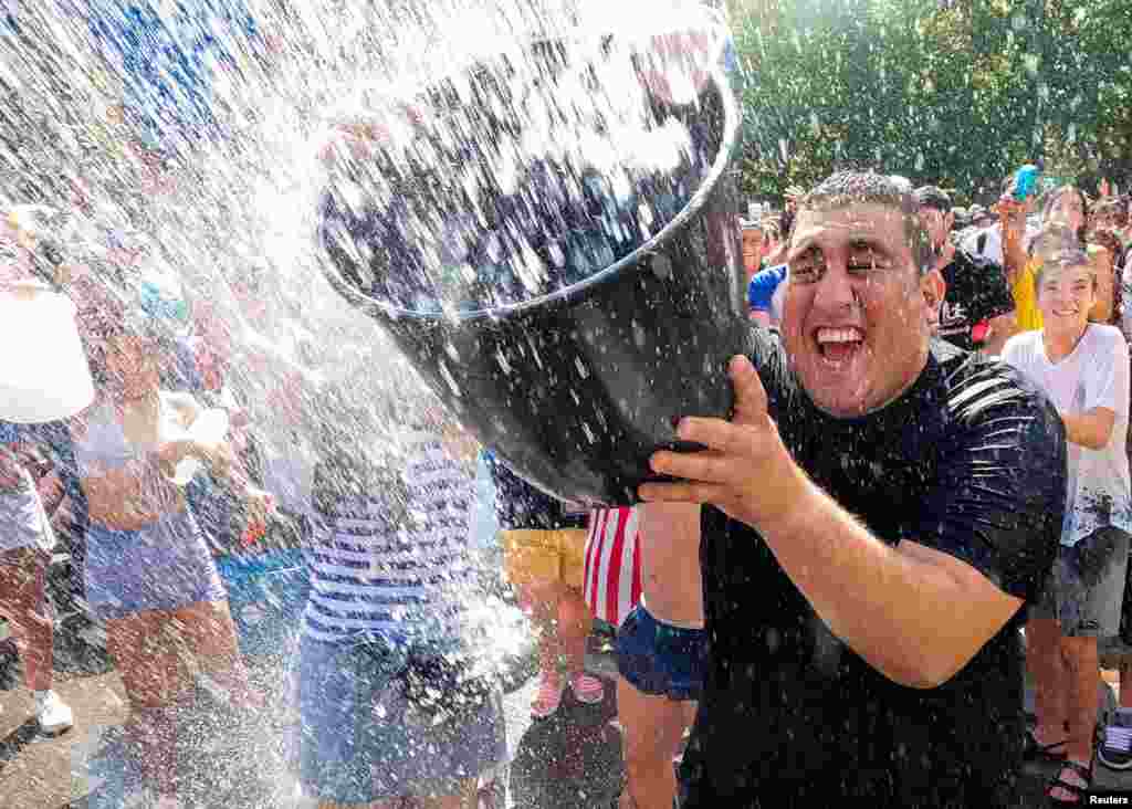Revelers take part in the annual &quot;Naval Battle&quot; of Vallecas in Madrid, Spain.