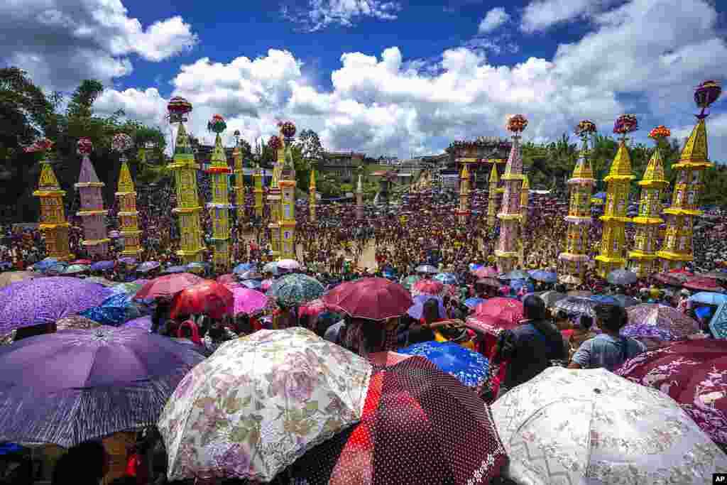 Pnar, or Jaintia, tribals carry &quot;Rongs&quot; or chariots, and dance in muddy waters during Behdienkhlam festival celebrations in Tuber village, in the northeastern state of Meghalaya, India. Behdienkhlam is a traditional festival of the Pnars celebrated after sowing is done seeking a good harvest and to drive away plague and diseases.