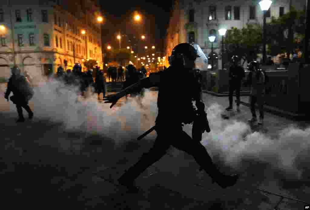 Tear gas is returned to police trying to break up supporters of ousted President Pedro Castillo at plaza San Martin in Lima, Peru, Dec. 11, 2022.&nbsp;Peru&#39;s Congress voted to remove Castillo from office and replace him with the vice president, shortly after Castillo tried to dissolve the legislature ahead of a scheduled vote to remove him.