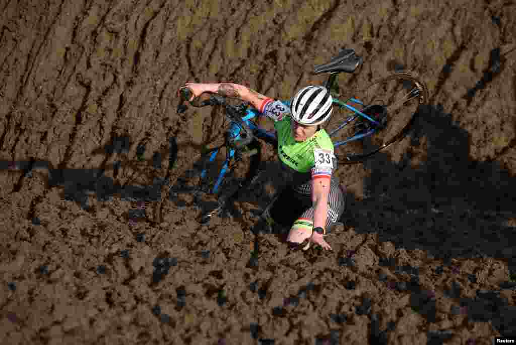 A competitor stumbles during the Junior women&#39;s race at the British Cyclocross championships near Milnthorpe, Britain.