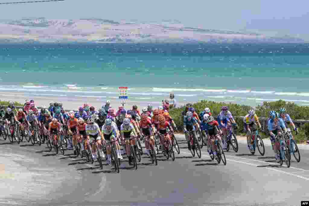 The peloton rides through the McLaren Vale wine district during stage one of the Women&#39;s Tour Down Under UCI cycling event in Adelaide, Australia.