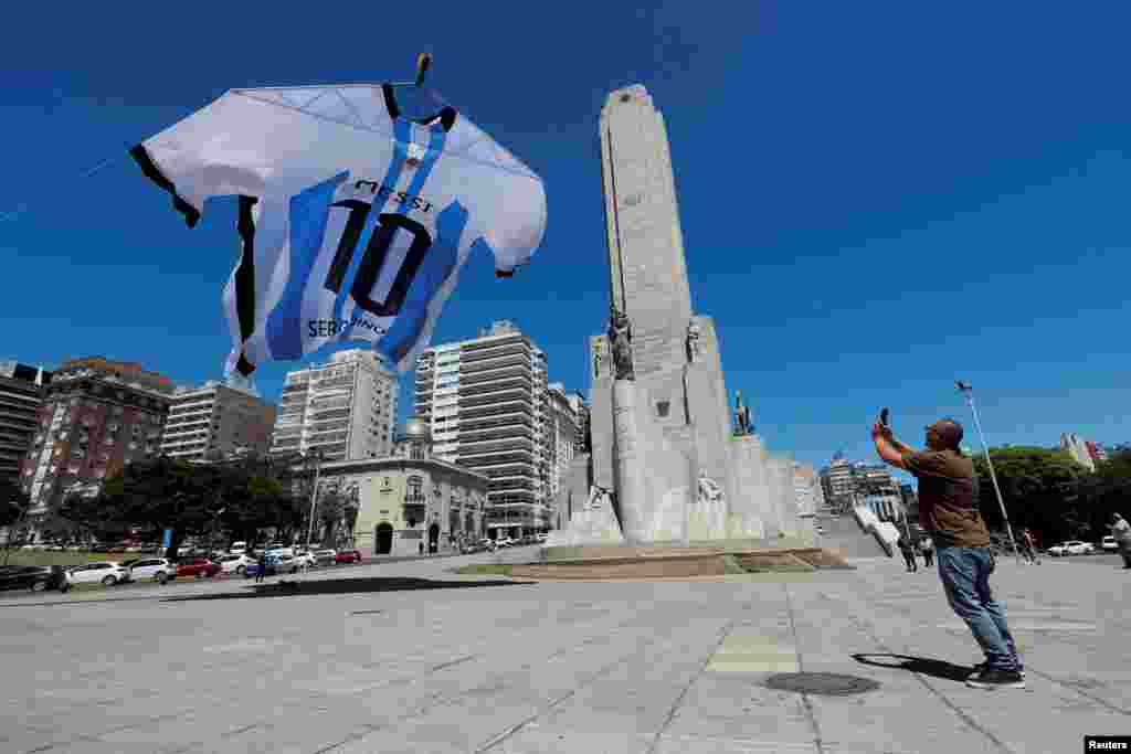 An 18-meter-long Argentina shirt featuring soccer star Lionel Messi&#39;s surname is displayed at the Monumento a la Bandera, in Rosario, Argentina.