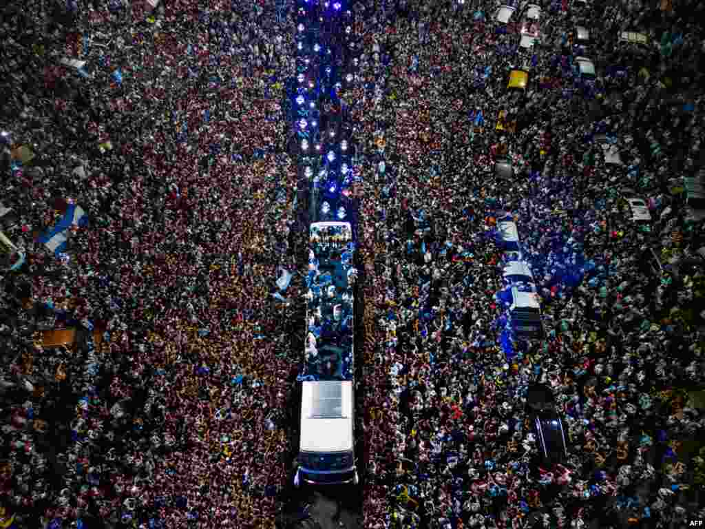 Argentina&#39;s soccer team is welcomed by fans&nbsp;after winning the Qatar 2022 World Cup tournament as they leave from Ezeiza International Airport to the Argentine Football Association training center in Ezeiza, Buenos Aires province.
