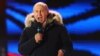  El presidente ruso, Vladimir Putin, habla a partidarios durante un acto cerca del Kremlin en Moscú, el domingo, 18 de marzo, de 2018.