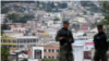 Soldados vigilan como parte de las medidas de seguridad antes de la juramentación de un nuevo mandato del presidente Juan Orlando Hernández, en Tegucigalpa. 26 de enero de 2018. 