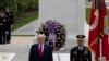President Donald Trump stands after placing a wreath at the Tomb of the Unknown Soldier in Arlington National Cemetery, in honor of Memorial Day, Monday, May 25, 2020, in Arlington, Va. (AP Photo/Alex Brandon)