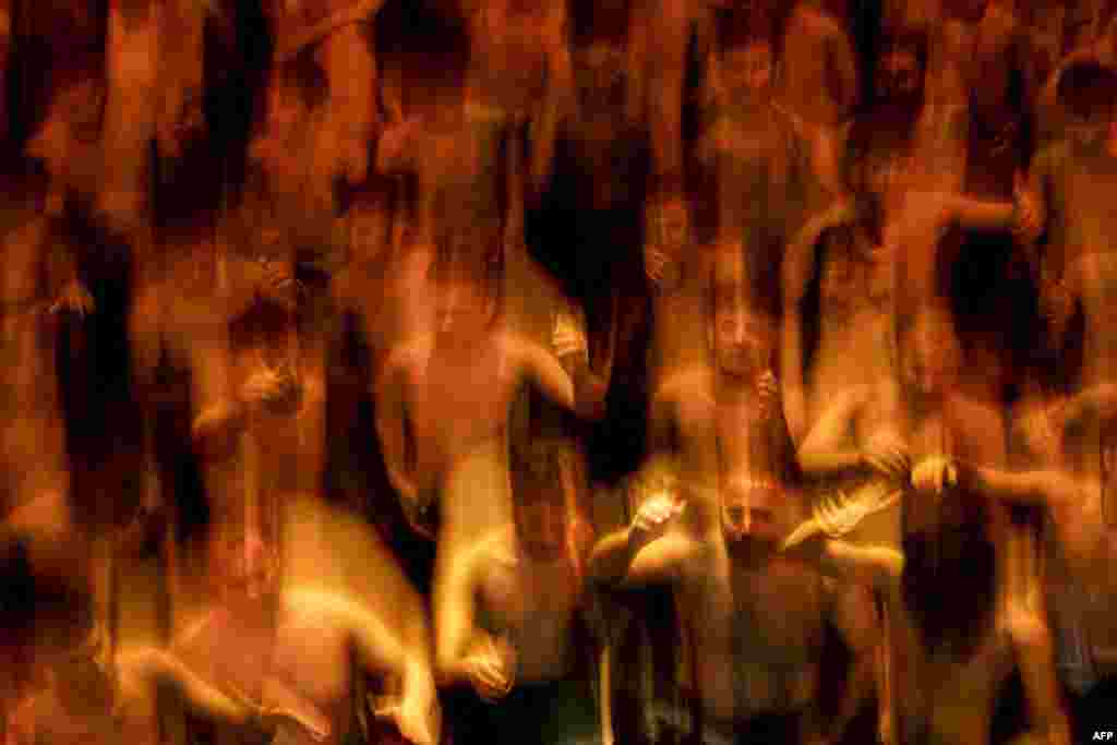 In this long exposure, Shiite Muslims take part in a mourning ritual in Iraq&#39;s southern city of Basra, during the Muslim month of Muharram in the lead-up to Ashura, a 10-day period commemorating the killing of Prophet Mohammed&#39;s grandson Imam Hussein in the battle of Karbala in 680.