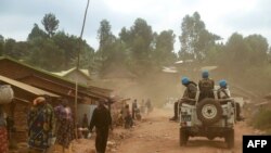 Des soldats de la mission de l'ONU en République démocratique du Congo (MONUSCO) patrouillent dans la région de Djugu, dans la province d'Ituri, dans l'est de la RDC, le 13 mars 2020.